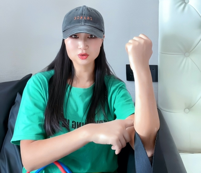 Person performing resistance band activation for elbow range of motion before rehab exercise